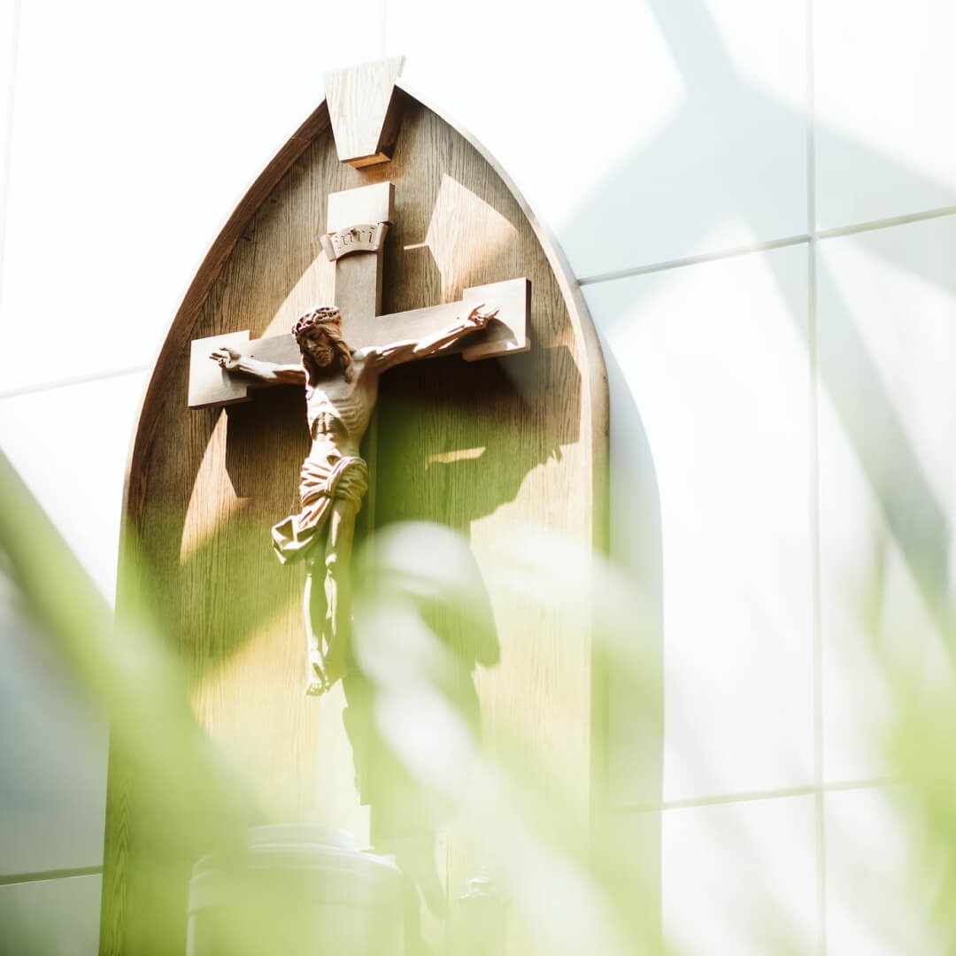 Crucifix of Jesus Christ displayed on the wall of a church.